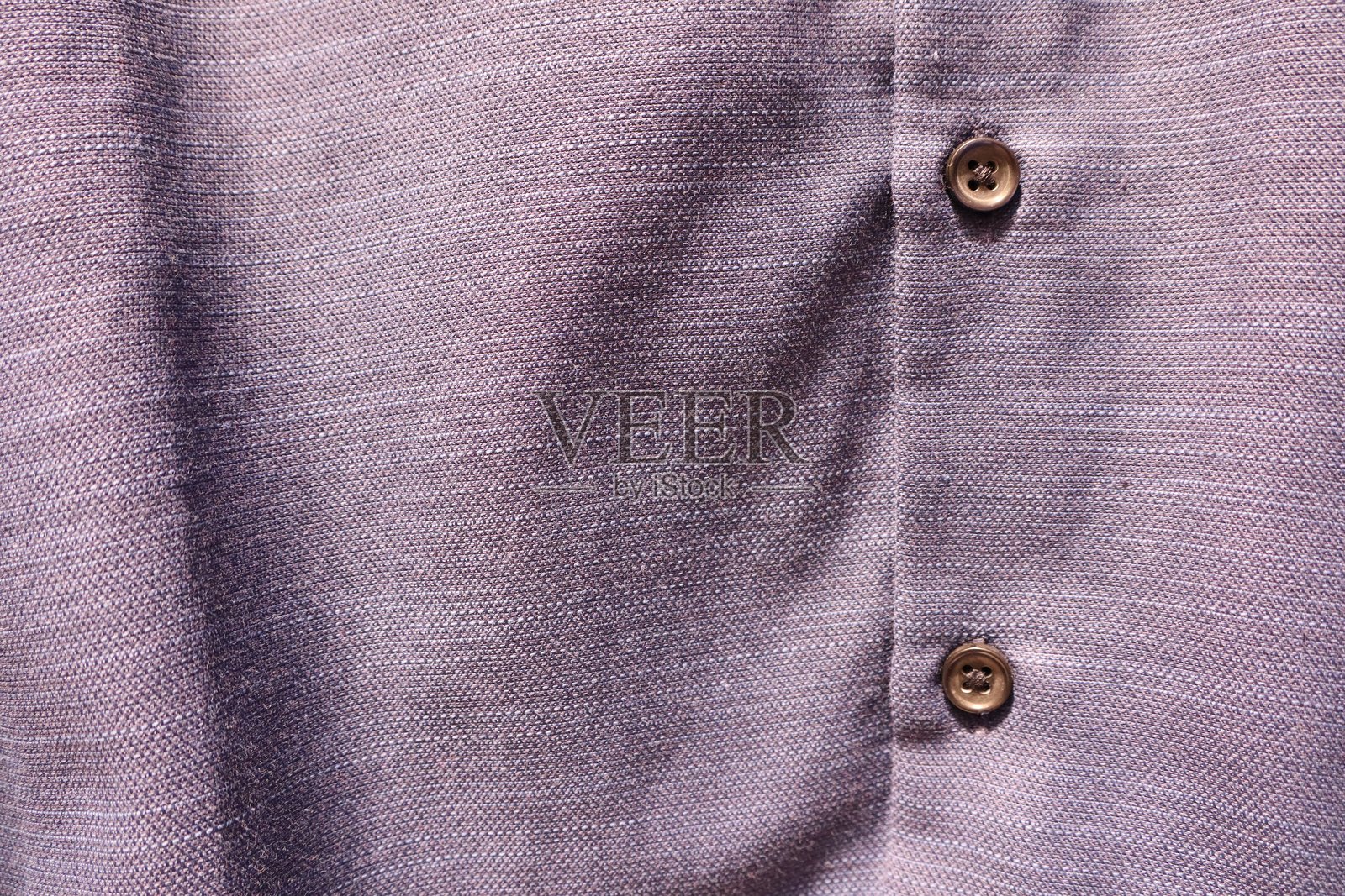 精美细致的特写，展示了装饰有时尚纽扣的复杂纹理面料照片摄影图片