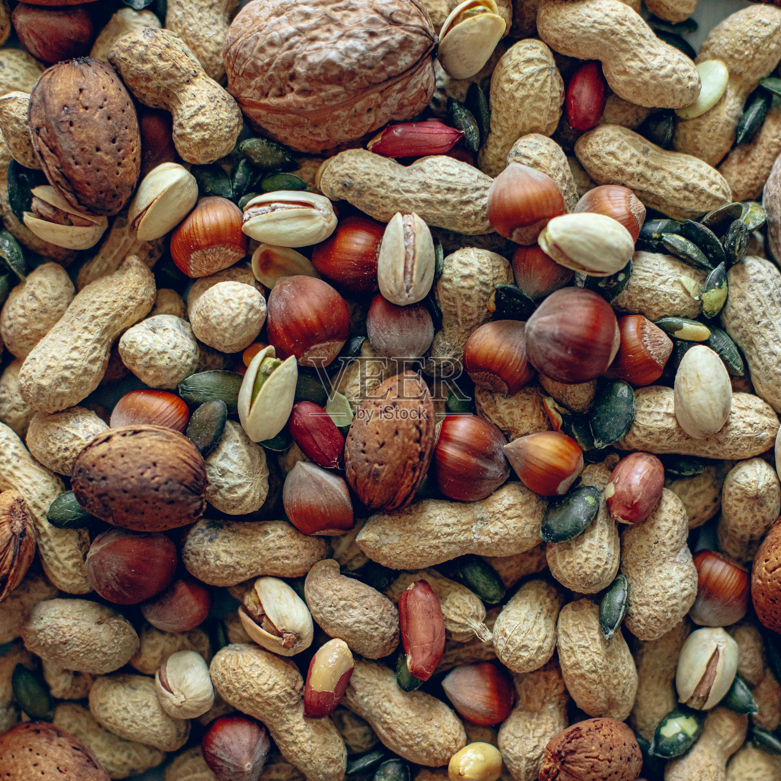 桌子上各种干果和坚果的特写镜头照片摄影图片