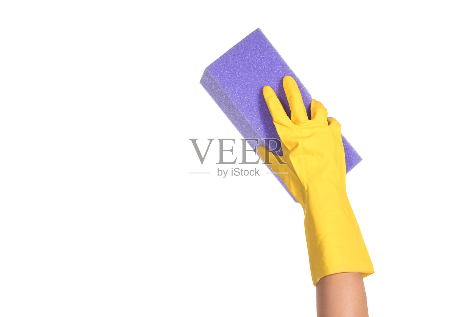 白色背景下的手握海绵照片摄影图片