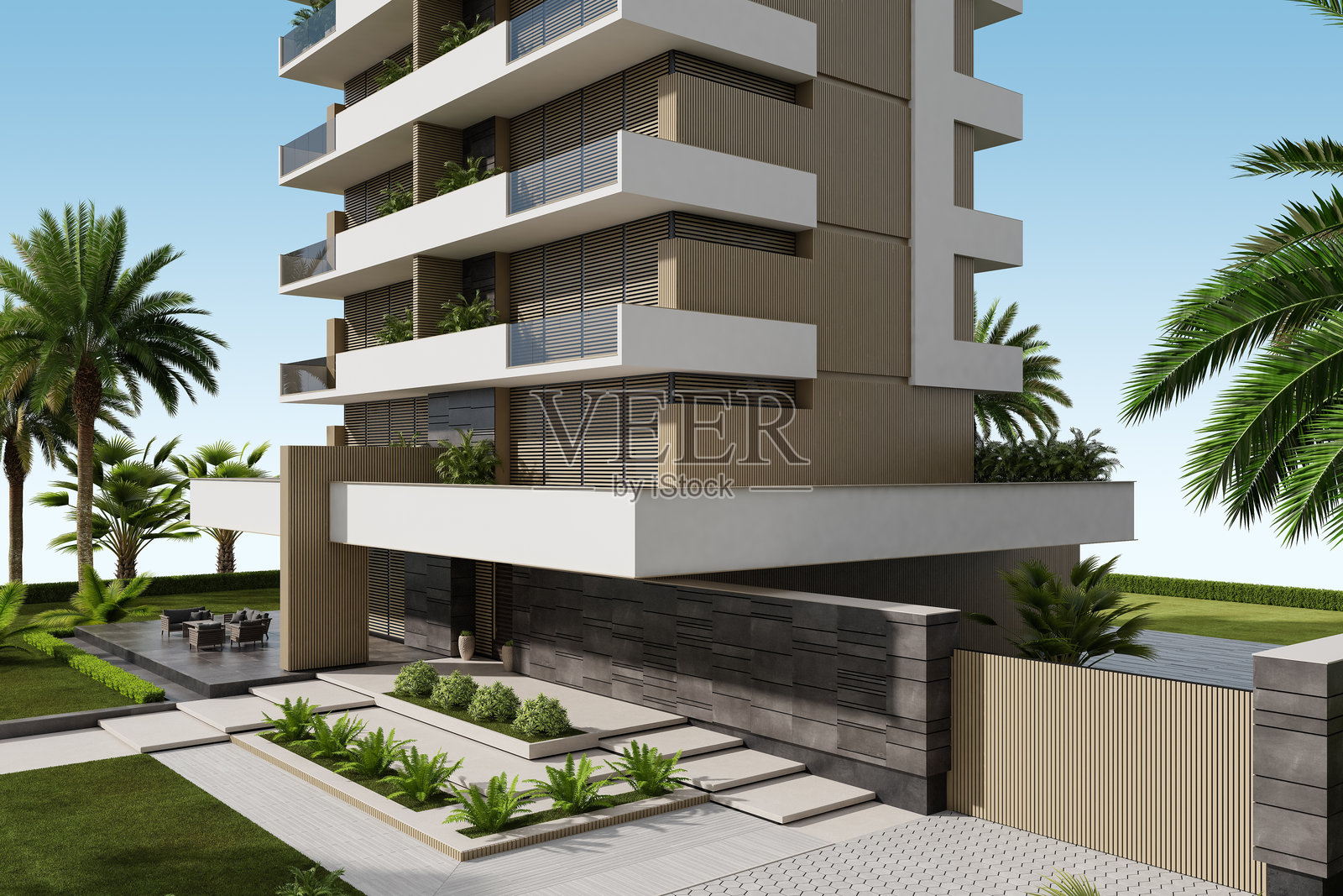 现代公寓大楼，配有大窗户、露台和郁郁葱葱的绿植照片摄影图片