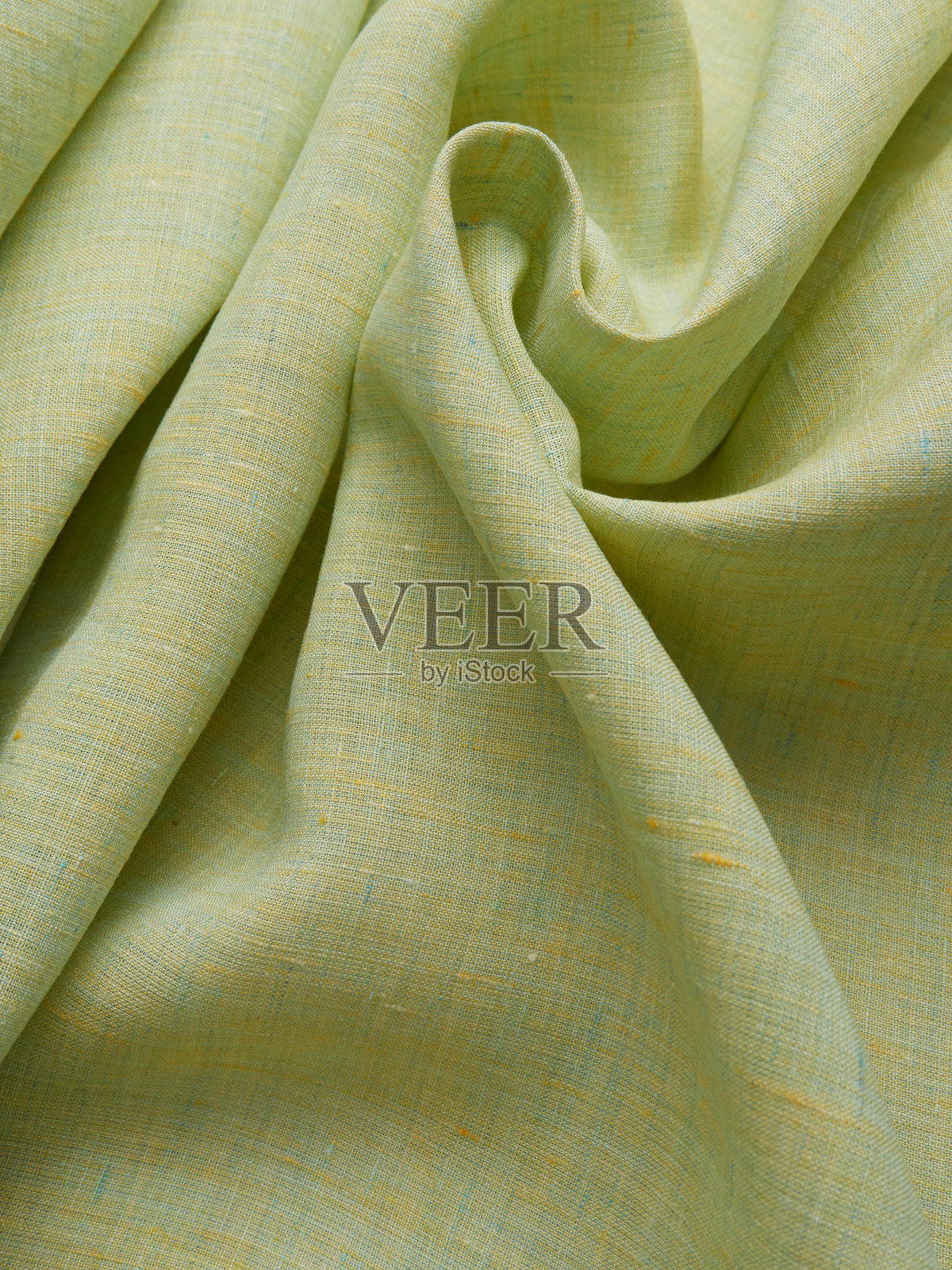 背景 - 新的黄绿色亚麻布料。照片摄影图片
