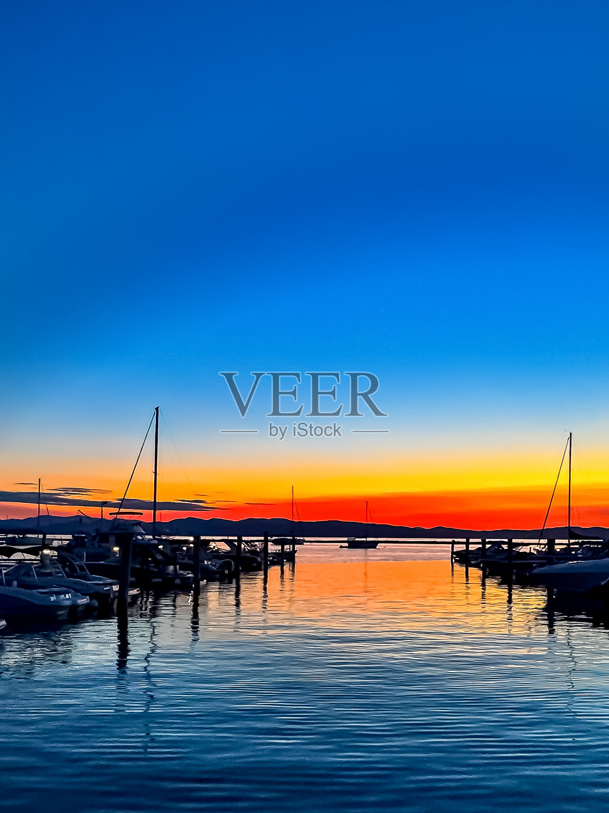 佛蒙特州伯灵顿的香普兰湖码头日落照片摄影图片