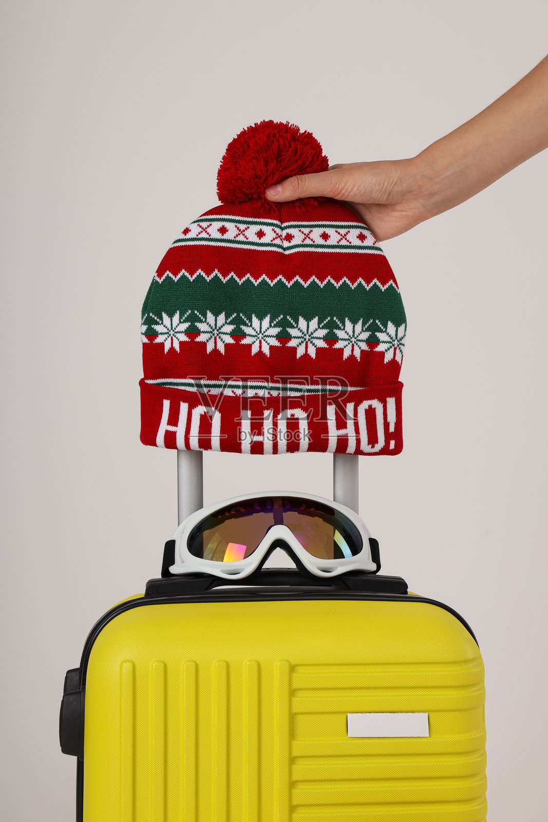 一个戴着节日帽子和眼镜的行李箱照片摄影图片