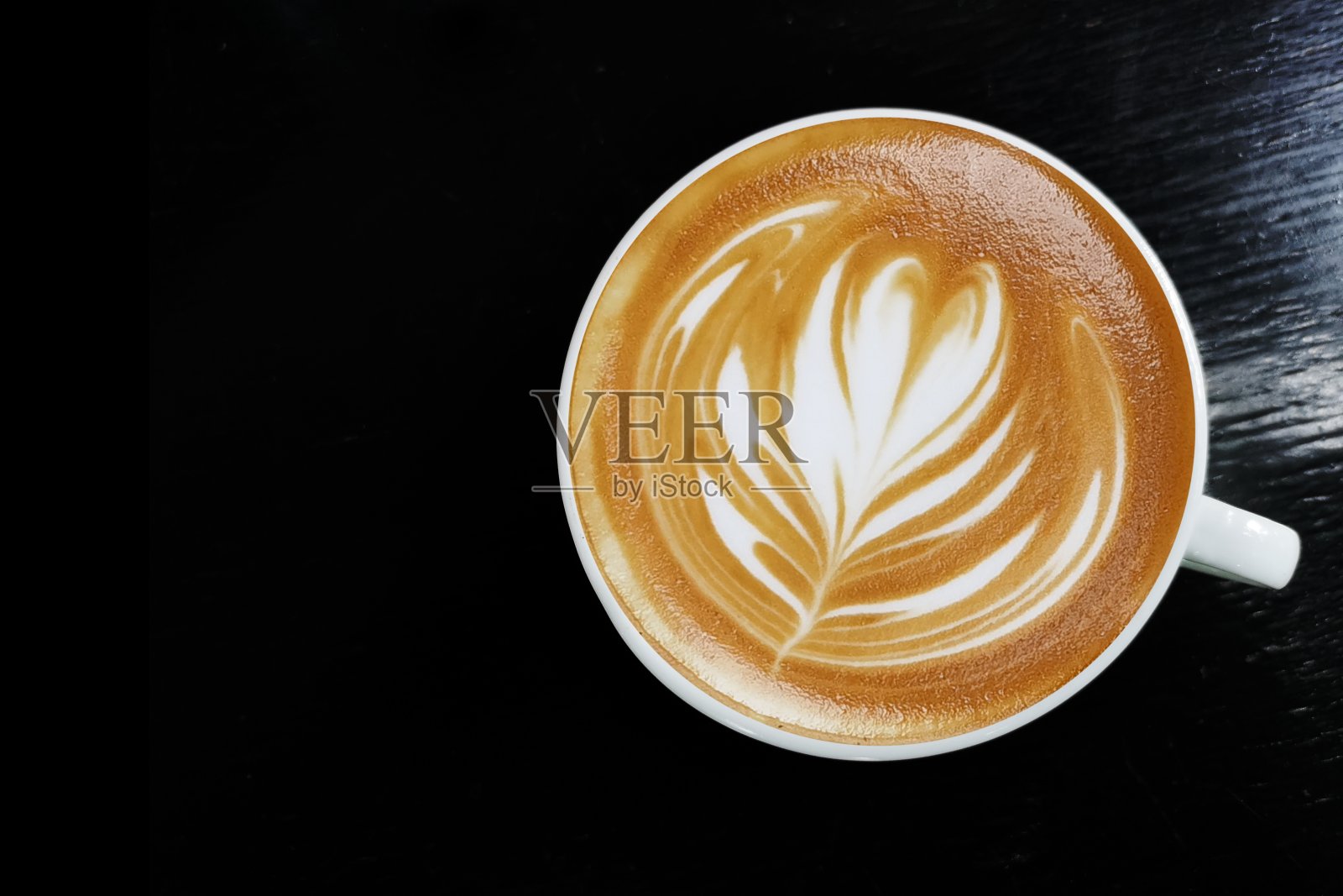 一杯拉花咖啡照片摄影图片