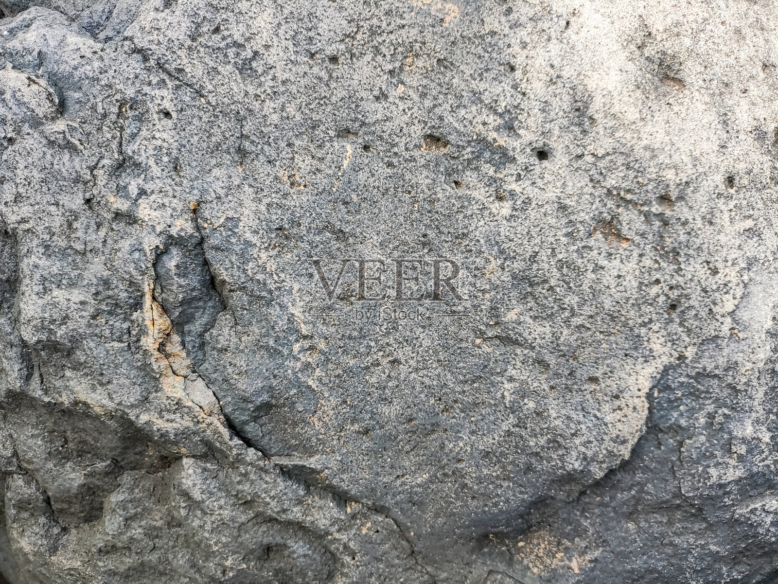 粗糙且开裂的岩石表面背景照片摄影图片