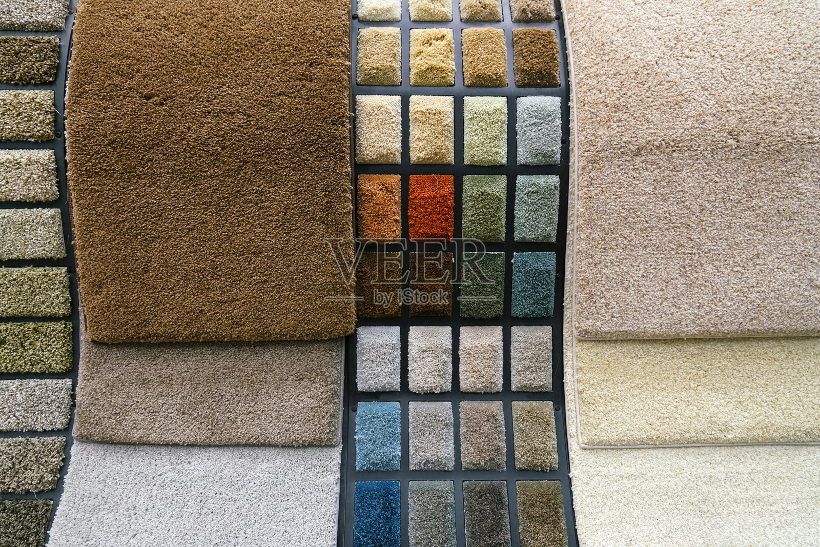 商店里的彩色地毯样品照片摄影图片