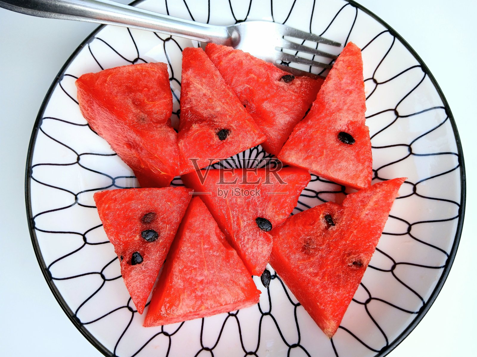 盘子上的西瓜。照片摄影图片