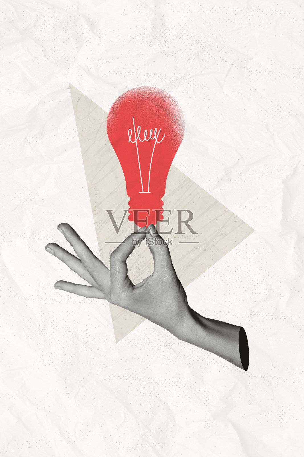 手臂握着红色灯泡的拼贴图，背景为米色。照片摄影图片