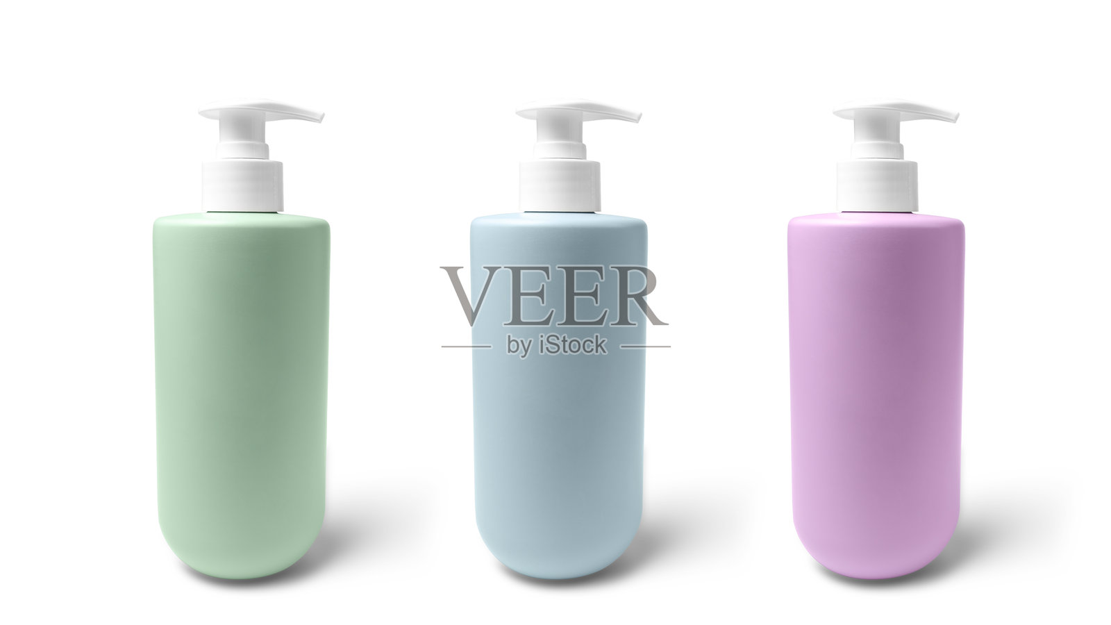 绿色、蓝色和紫色的无品牌泵瓶，适用于液体肥皂、洗发水或乳液，背景为白色。照片摄影图片