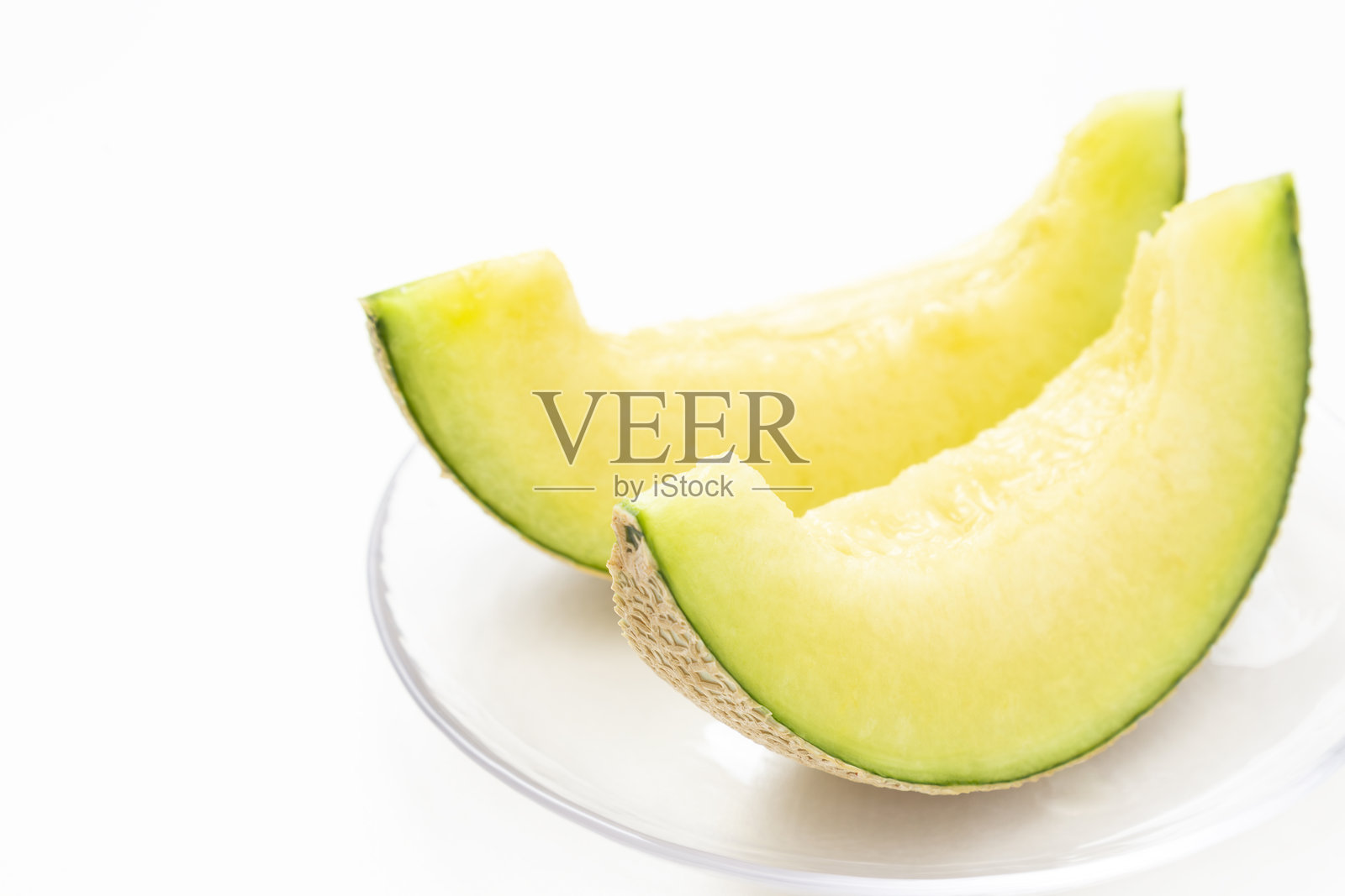 新鲜的哈密瓜在白色背景上照片摄影图片