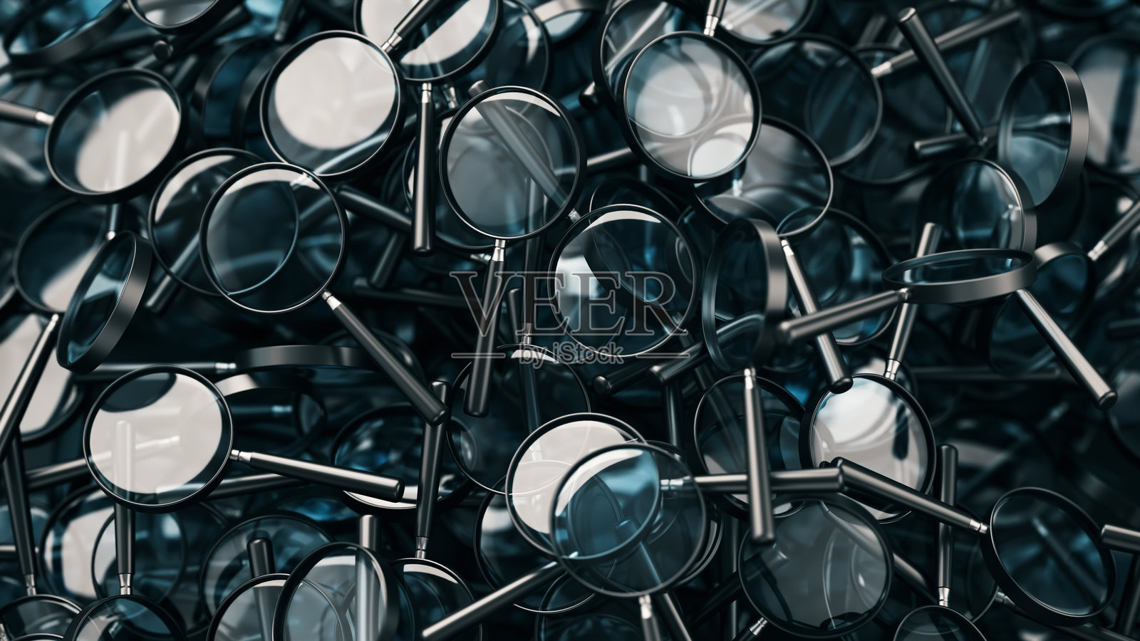 放大镜堆叠在背景上照片摄影图片