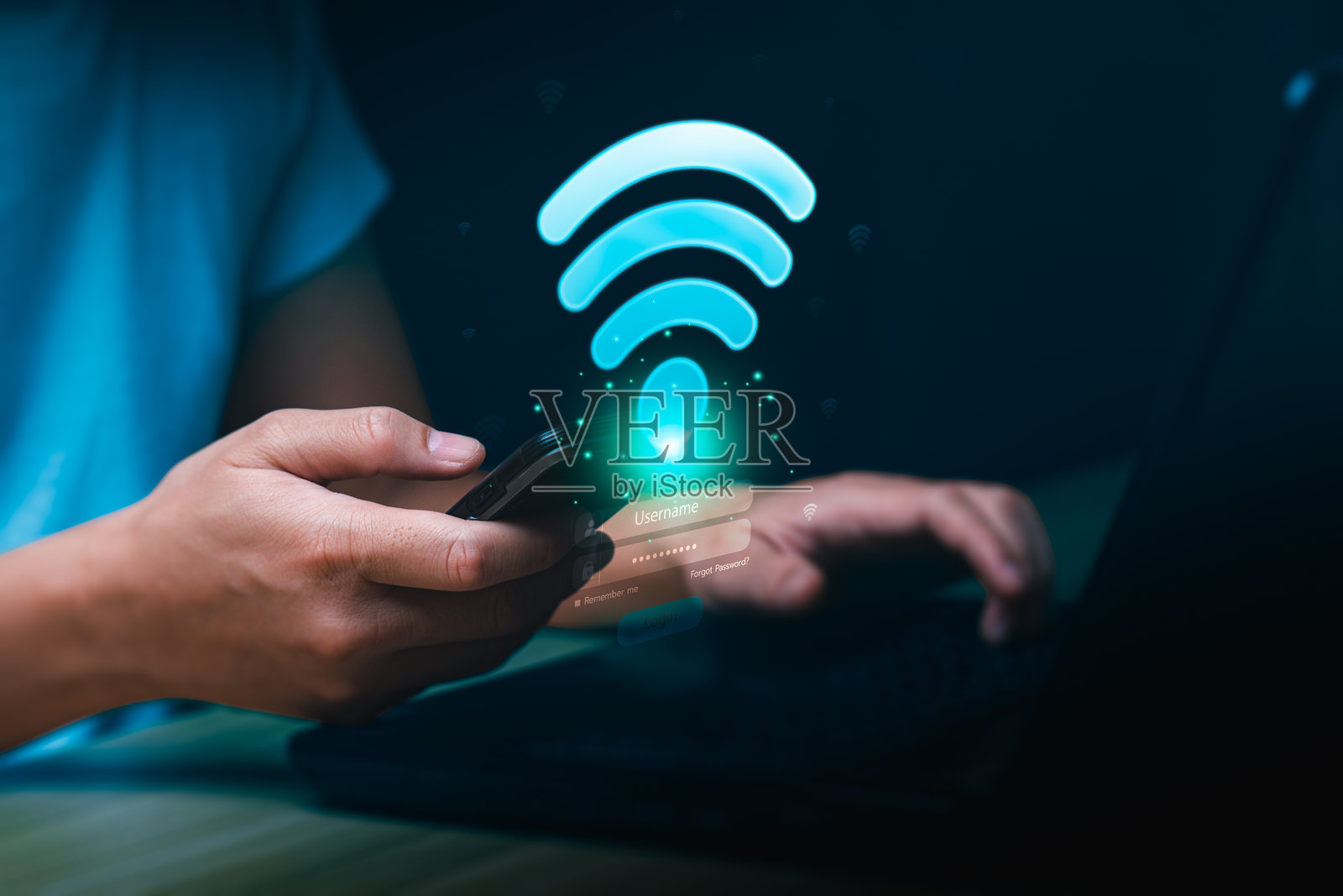 手握手机和笔记本电脑，屏幕上显示发光的WiFi图标和登录界面，体现科技概念。数字无线互联网连接和安全访问，便于在线沟通和数据交换。照片摄影图片