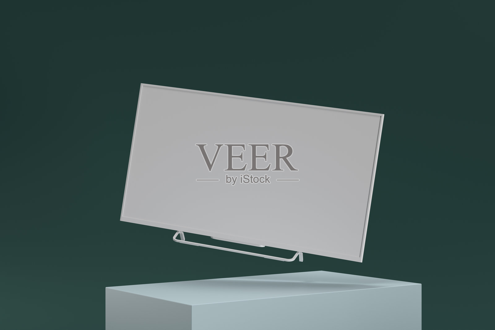 一台白色电脑显示器展示在绿色背景上照片摄影图片