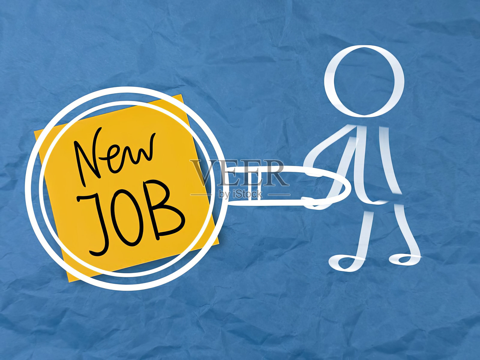 纸上写着“工作”这个词。照片摄影图片