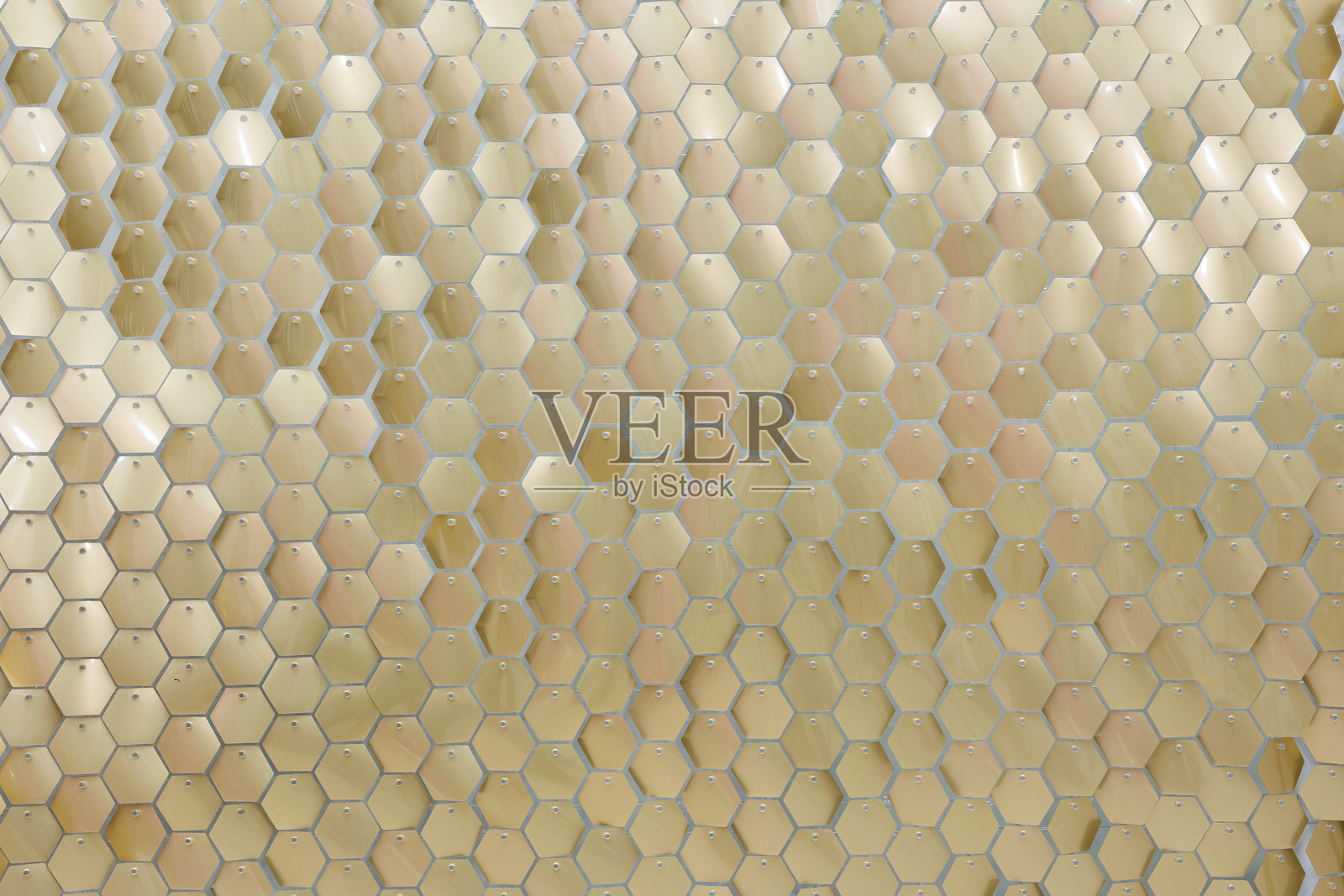 闪亮的金色亮片特写。一个由亮片组成的拍照区。照片摄影图片