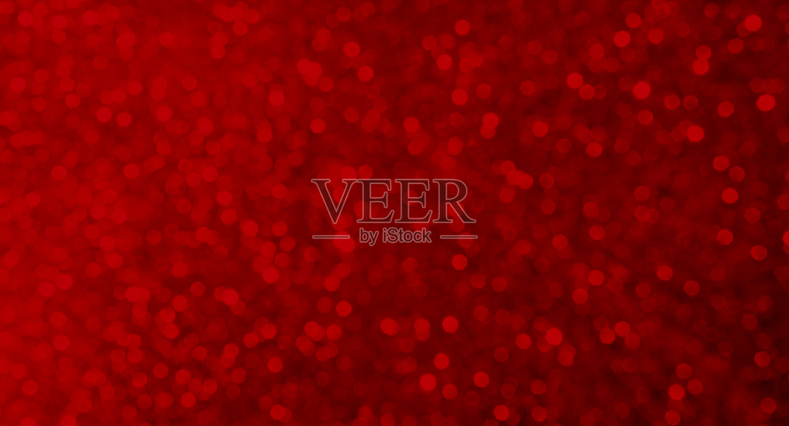 背景虚化红色抽象图案设计，闪光庆祝夜晚幻想气泡装饰，明亮发光的节日背景，闪烁效果，魅力魔法，天堂般的光辉幻想。照片摄影图片