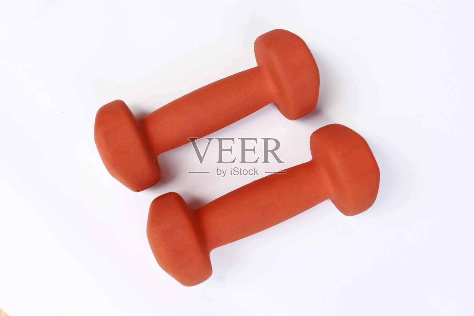 两个橙色的哑铃用于健身和运动照片摄影图片