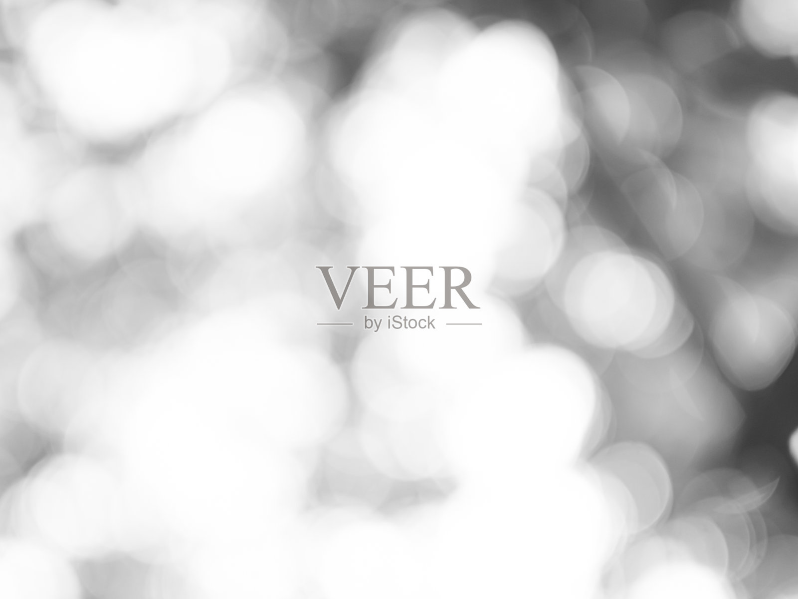 灰色背景虚化抽象白色米色圆形光纹理气泡模糊图案失焦发光闪烁雪花闪光雪花魔幻背景生态系统前景卡片银色空间装饰。照片摄影图片