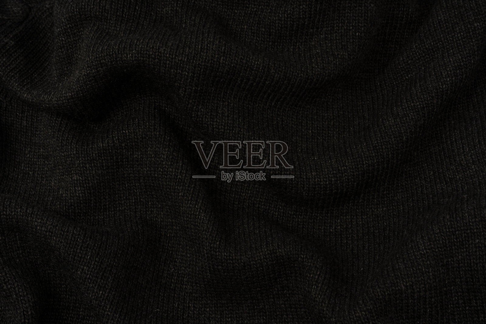 深灰色毛衣纹理作为背景。编织图案。照片摄影图片