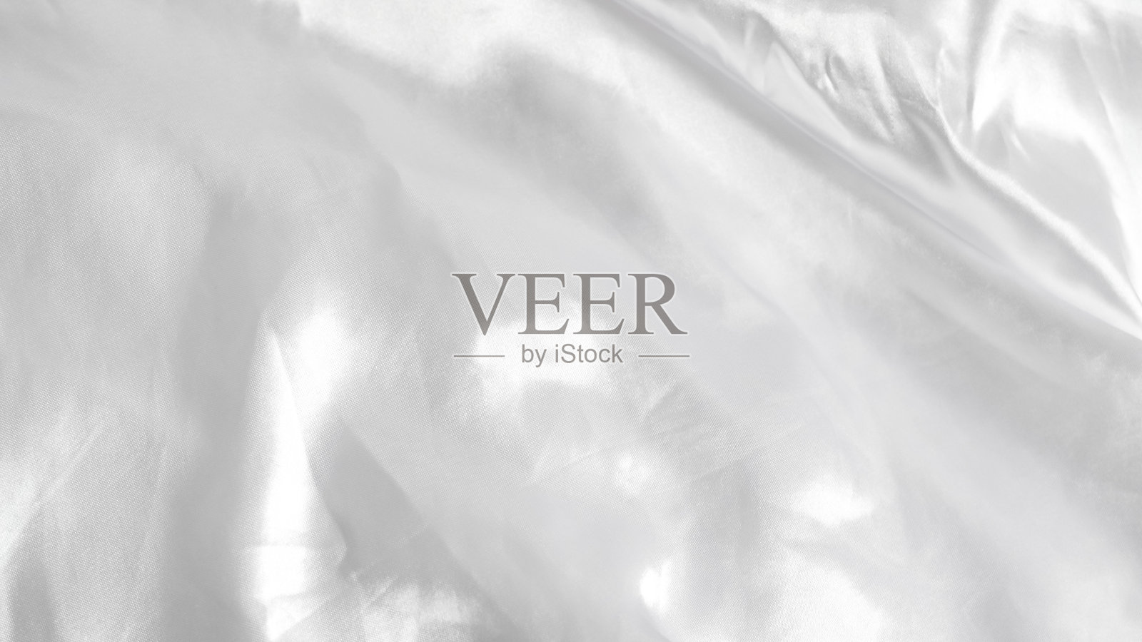 光滑的白色丝绸床单，柔软奢华的面料，优雅的毯子背景照片摄影图片