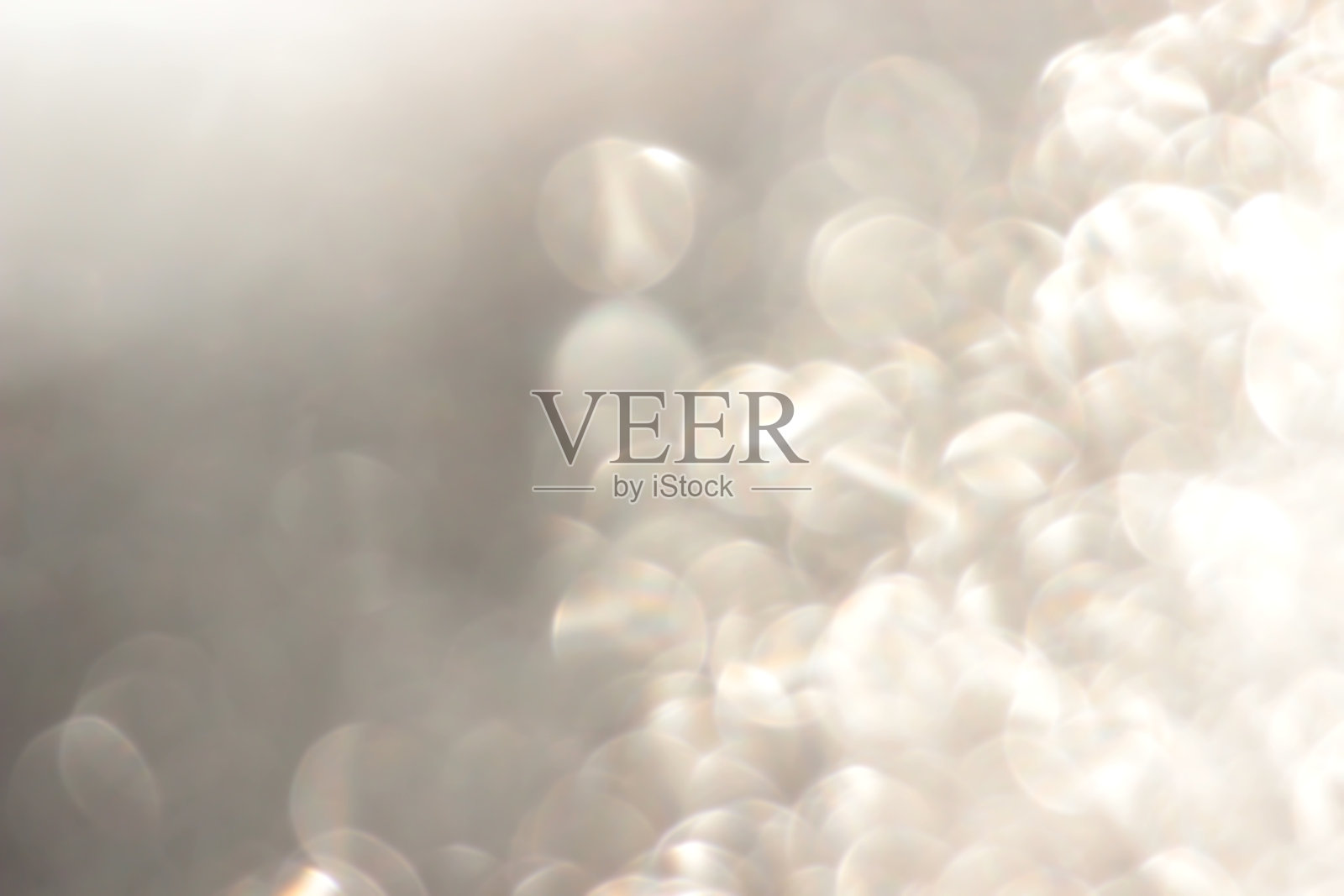 模糊的米色金色粉彩背景，带有散景效果照片摄影图片