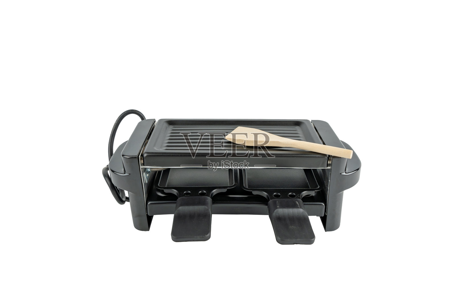 电动瑞士烤干酪炉用于制作加工奶酪。照片摄影图片