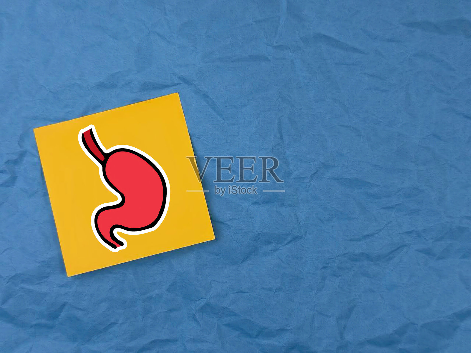 手握办公纸。办公纸上的健康胃部图画。健康的胃。关于健康胃部的横幅。医疗保健。胃癌。生物胃。照片摄影图片