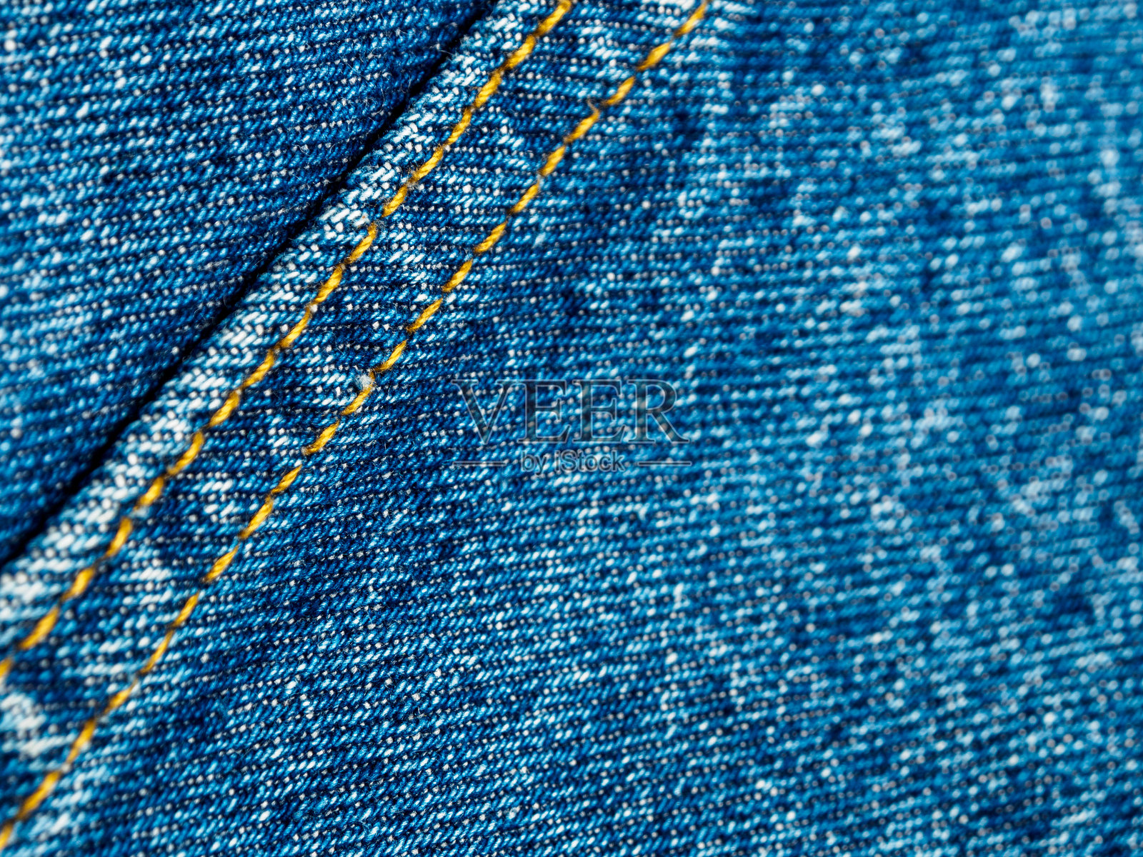 牛仔布特写，突出纹理和细节。非常适合时尚和纺织行业主题。照片摄影图片