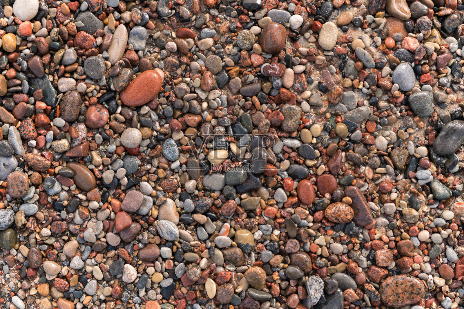 海岸上的五彩光滑石头照片摄影图片