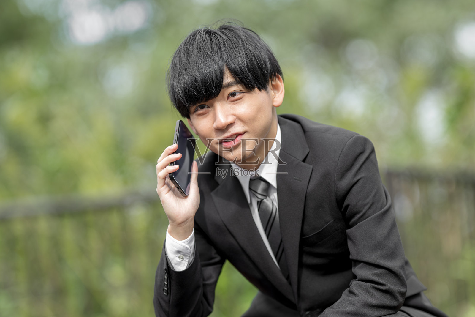 商人和手机照片摄影图片