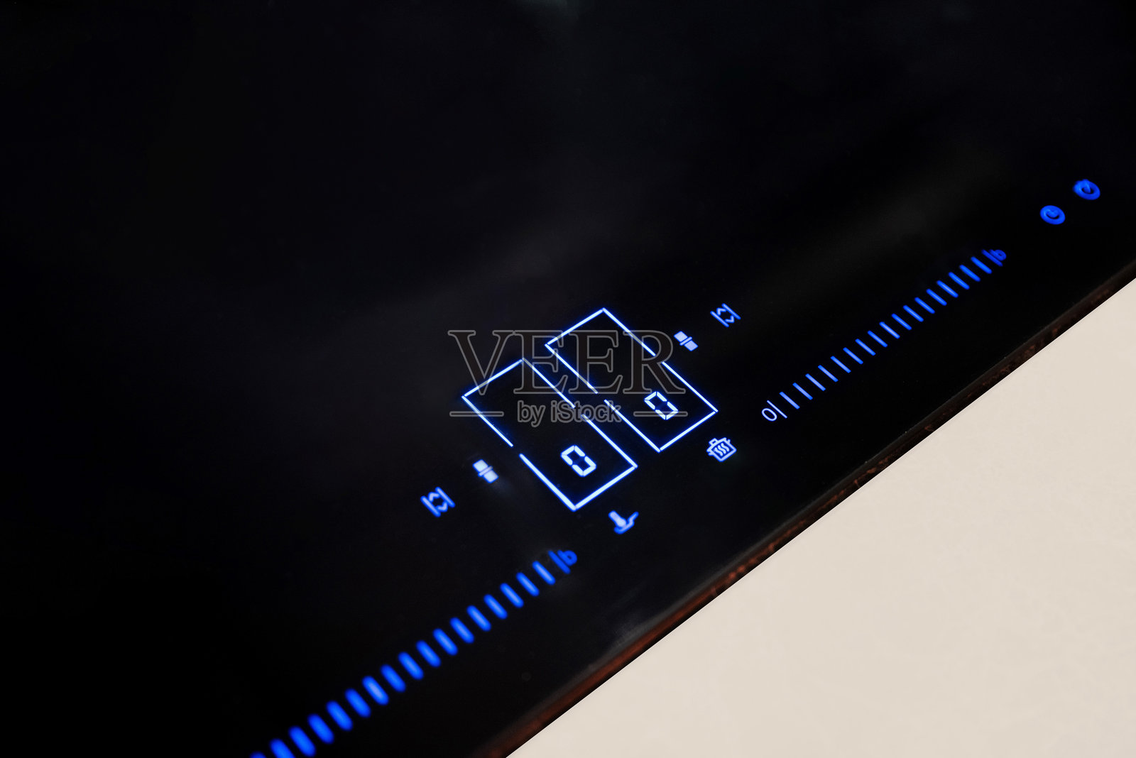 黑色电磁炉灶上的控制面板特写照片摄影图片