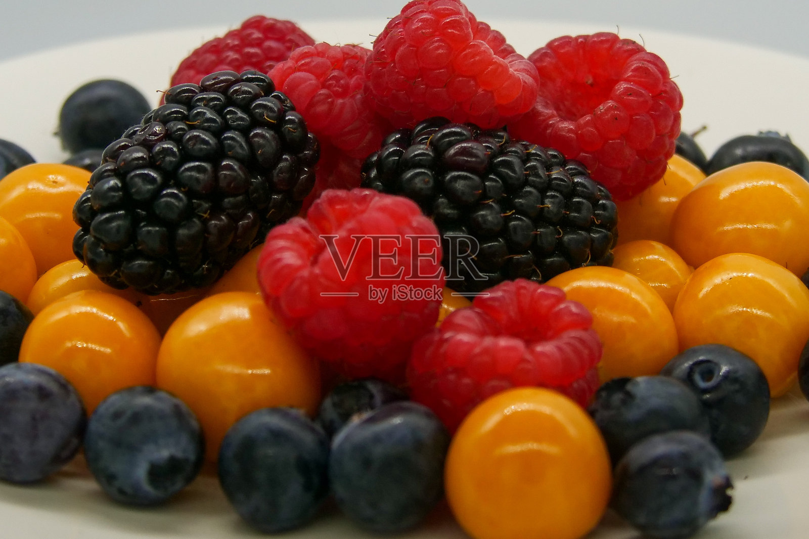 鲜艳色彩的新鲜浆果特写镜头。照片摄影图片