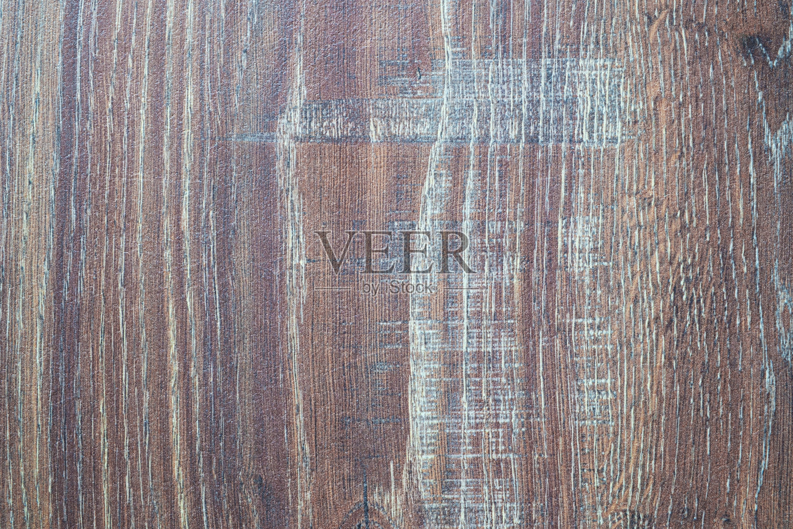 木纹非常明显，质地粗糙。木材呈棕色，具有自然的外观。照片摄影图片