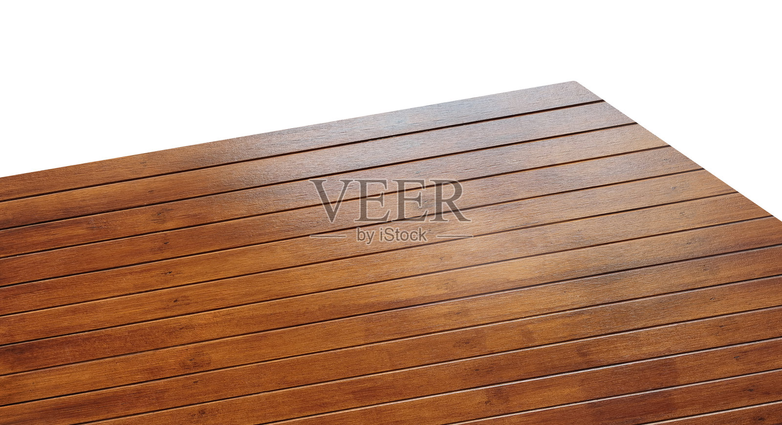 木质桌面角落的视图，背景为白色。照片摄影图片