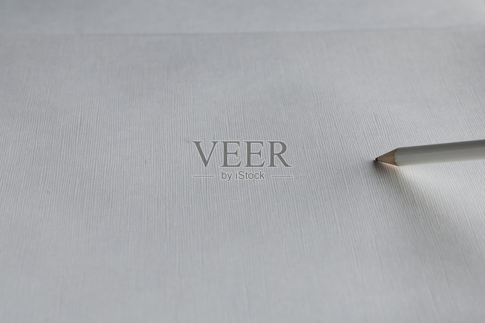 白色铅笔在纸上的特写镜头照片摄影图片