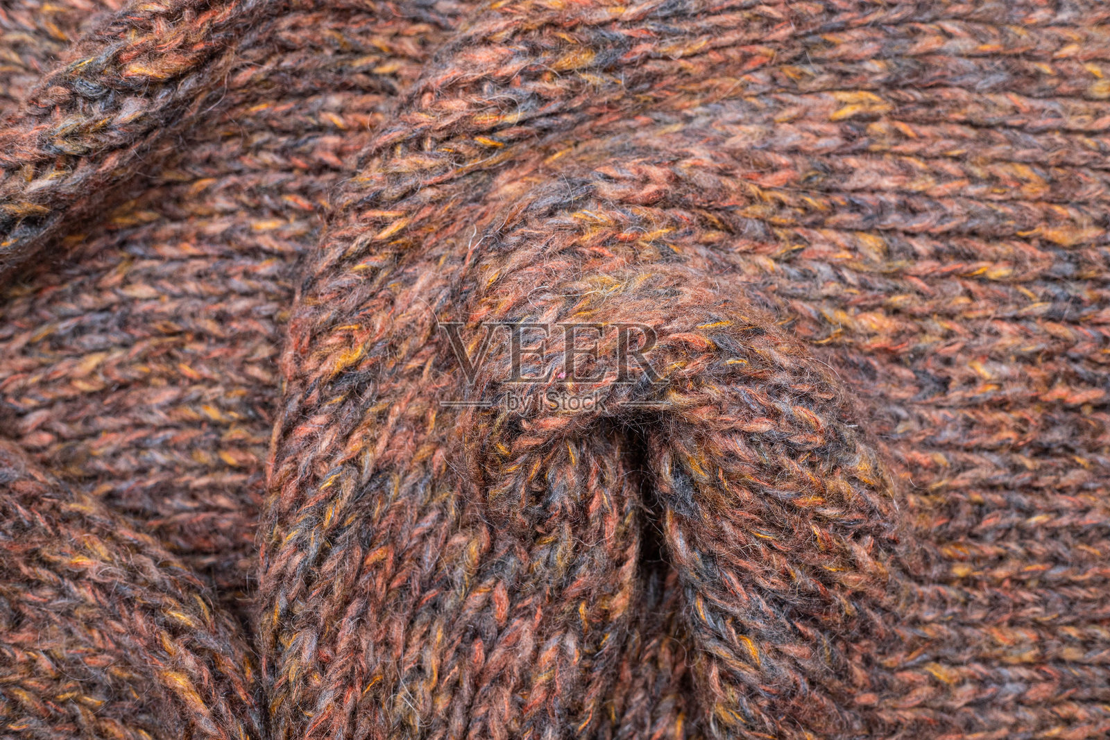 温暖的中性色毛线毯，带有流苏边缘照片摄影图片