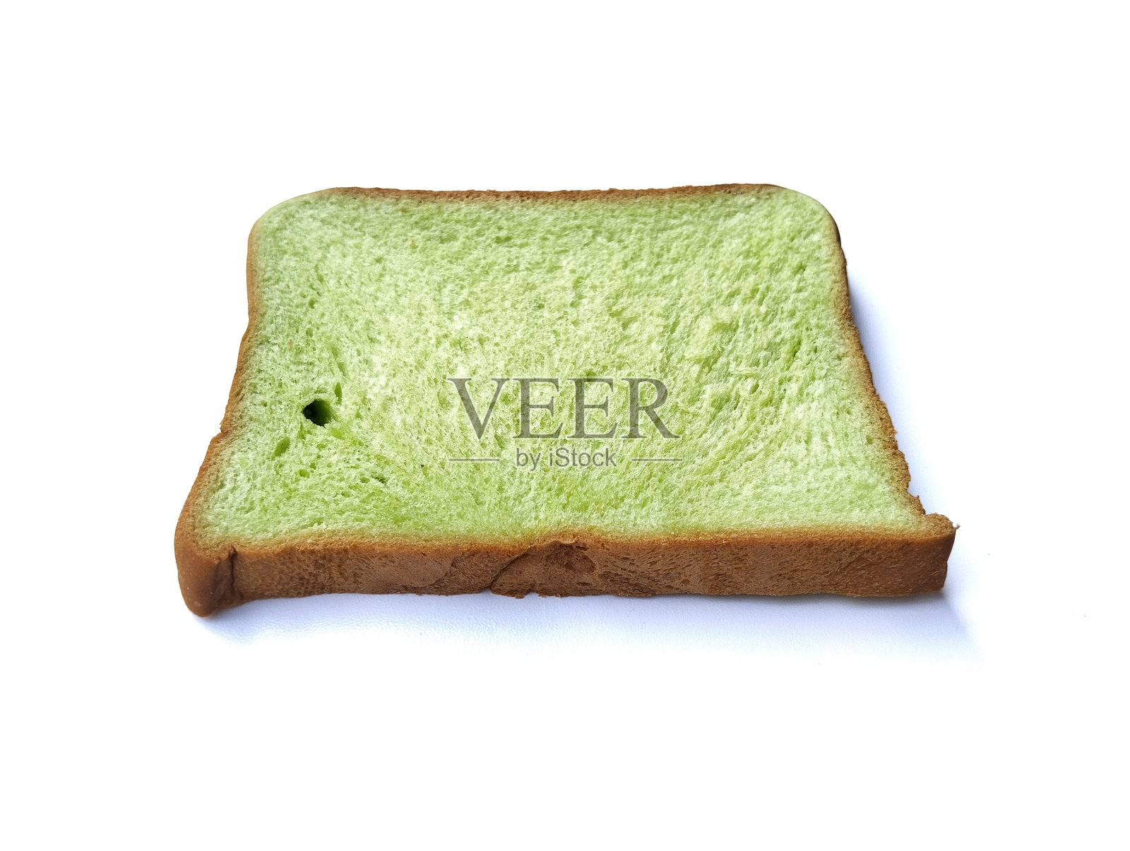 一片绿色吐司面包，孤立在白色背景上照片摄影图片