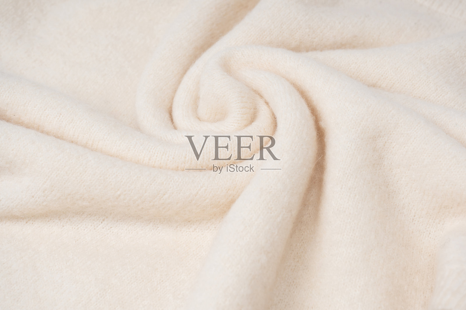 米色毛衣纹理作为背景。照片摄影图片