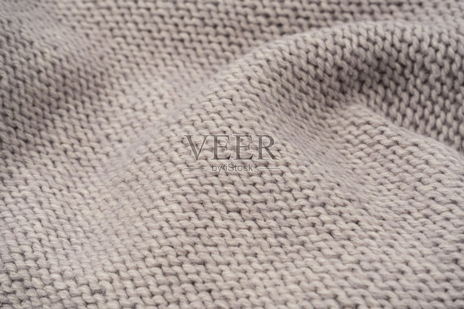 灰色羊毛毛衣纹理作为背景。照片摄影图片