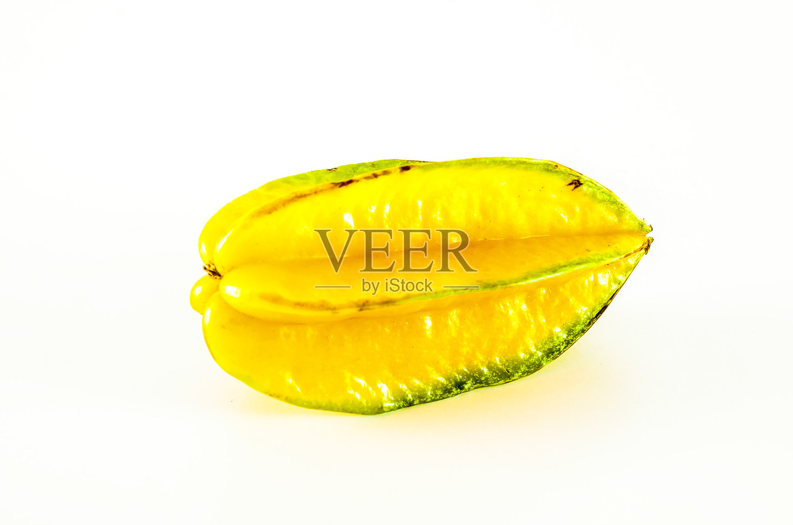 一个带有绿色茎的黄色水果照片摄影图片