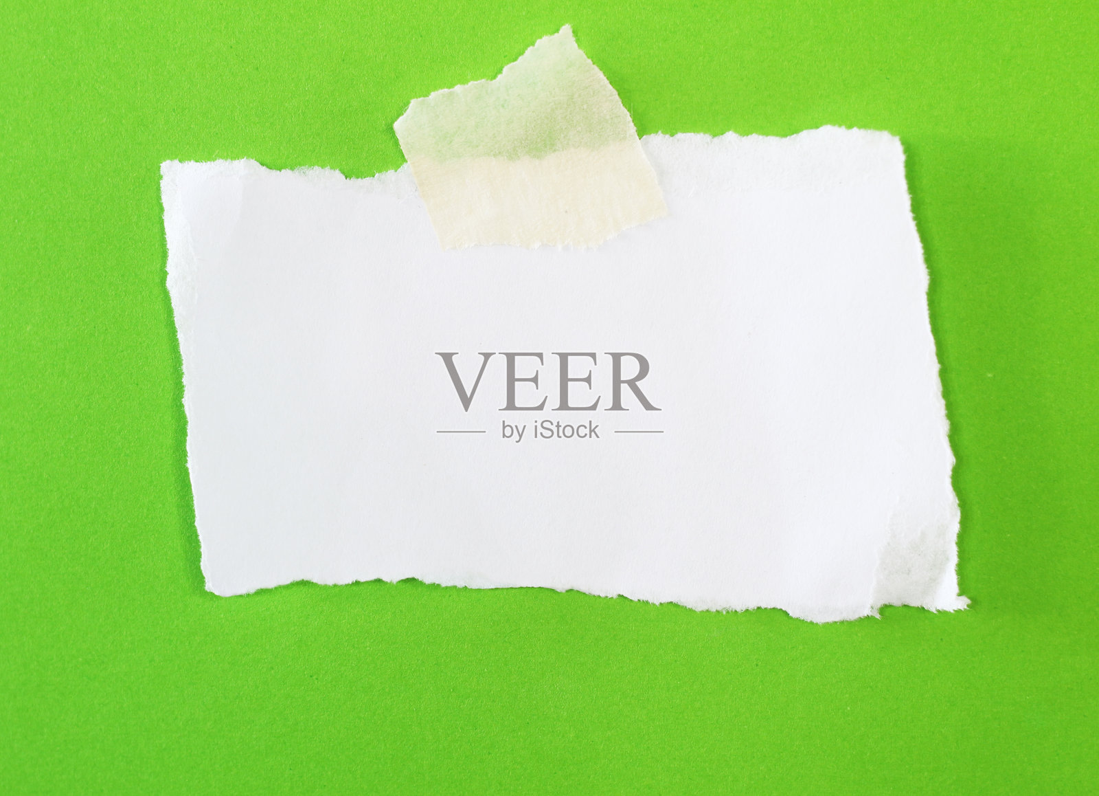 撕裂的纸张上贴着胶带照片摄影图片