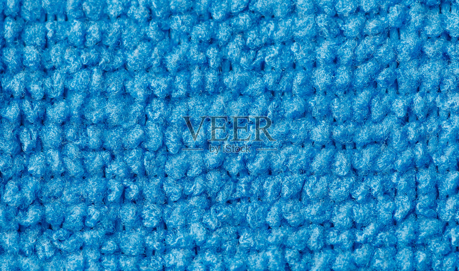 蓝色毛巾与蓝色背景照片摄影图片