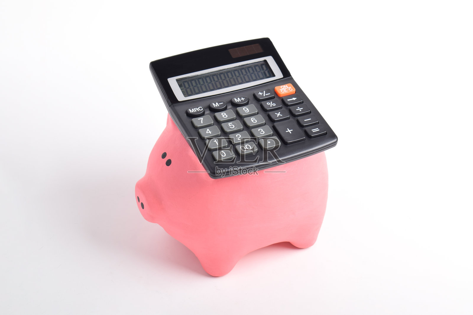 储蓄罐和计算器照片摄影图片