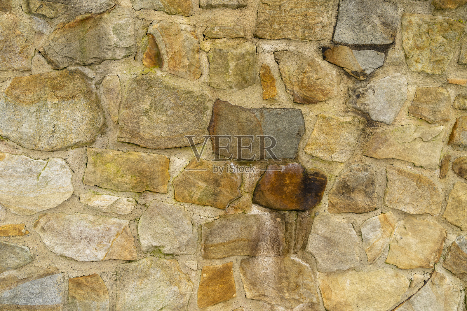 岩石元素构成的墙壁纹理。照片摄影图片