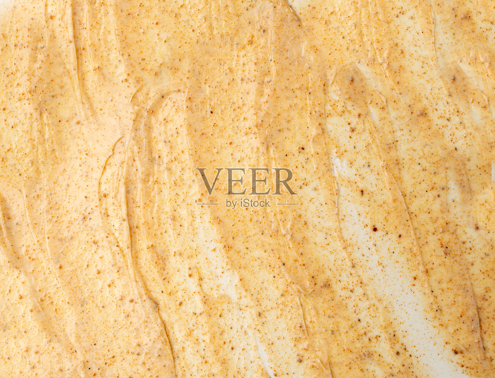 杏仁磨砂膏涂抹，独立的身体去角质霜样品，有机去角质面膜，糖磨砂膏涂抹照片摄影图片