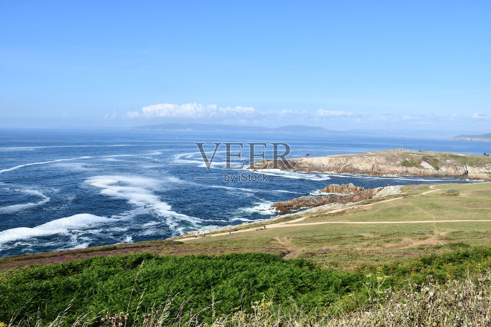 海岸景观，作为背景的照片，位于西班牙加利西亚的阿科鲁尼亚，欧洲，赫库勒斯灯塔。照片摄影图片