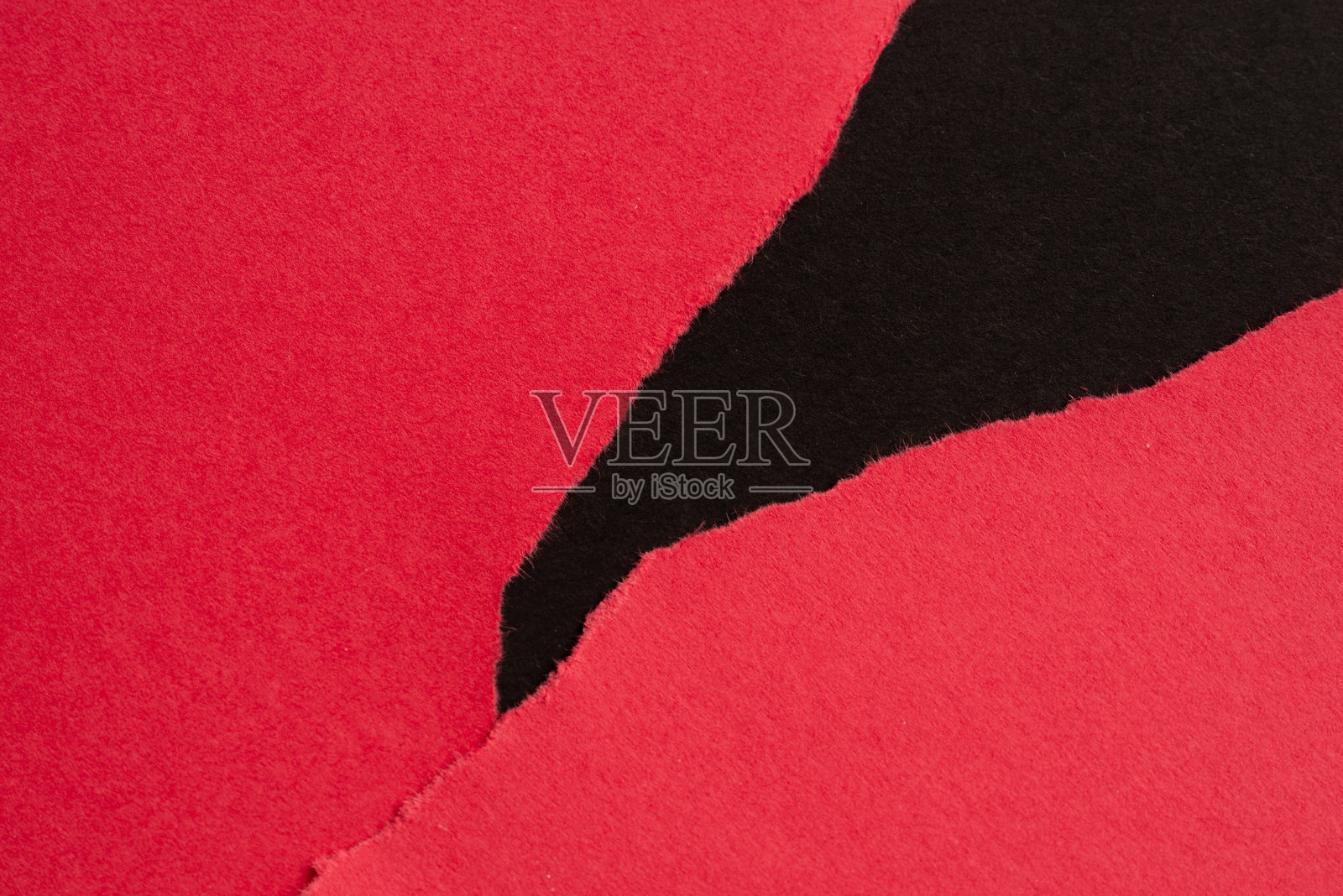 撕裂的红色和黑色建筑纸照片摄影图片