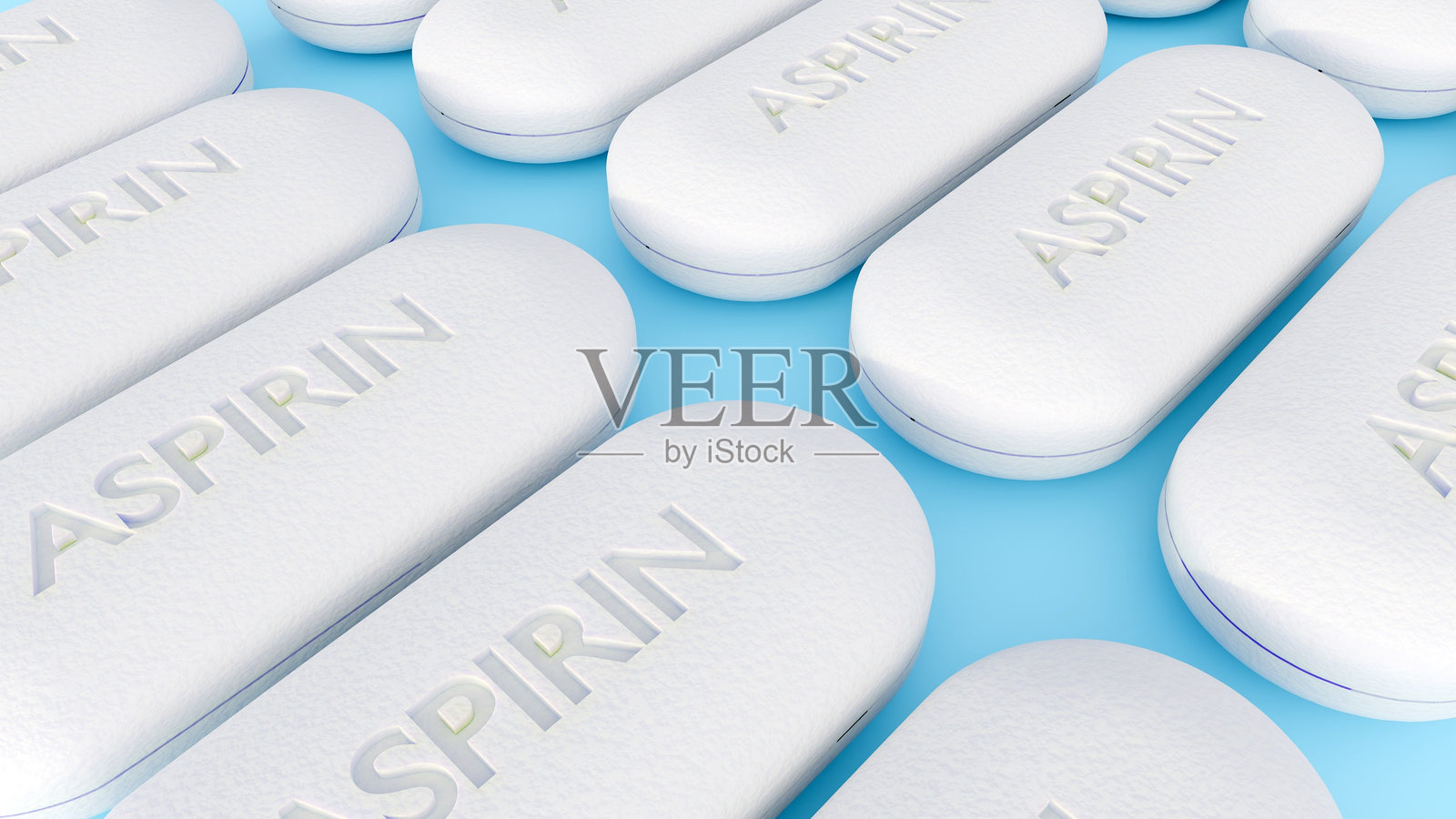 白色椭圆形阿司匹林片聚集在蓝色表面上照片摄影图片