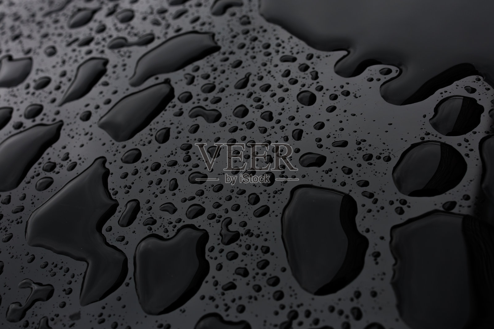 灰色表面上的水滴特写照片摄影图片