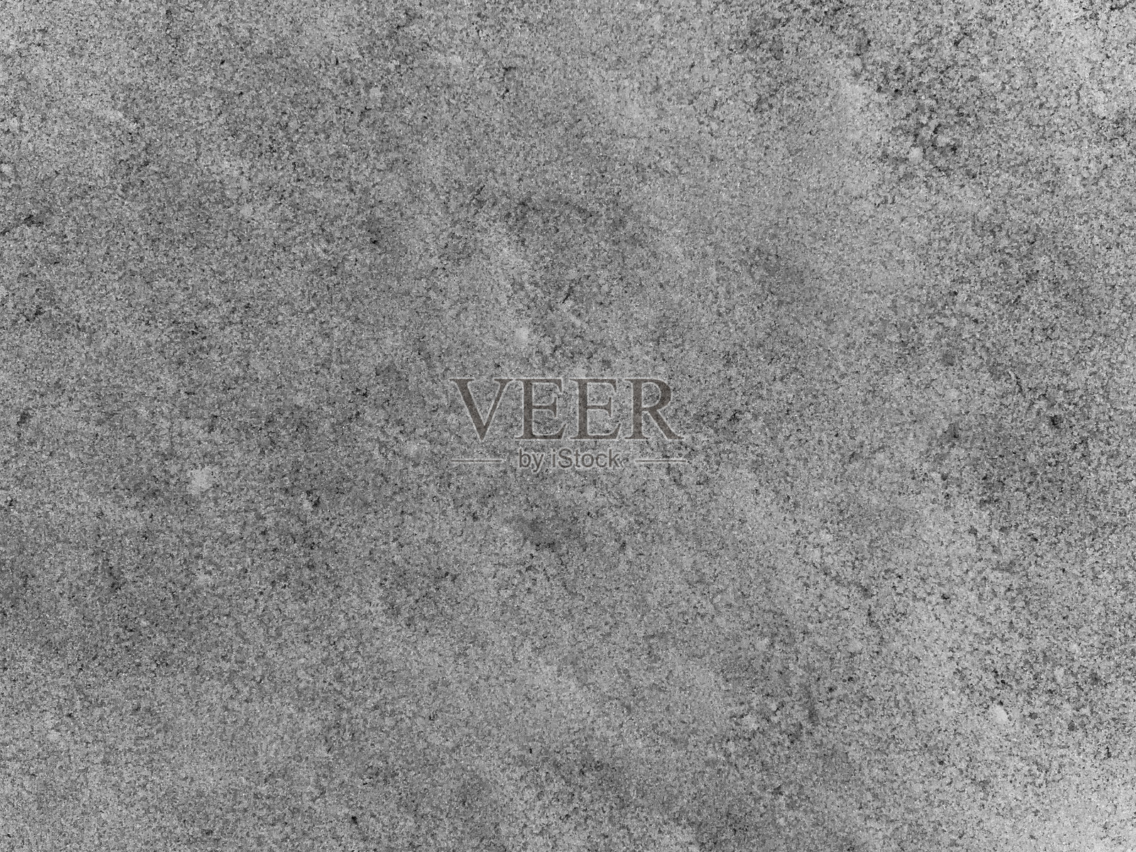 一块灰色的表面上布满了许多小石头照片摄影图片